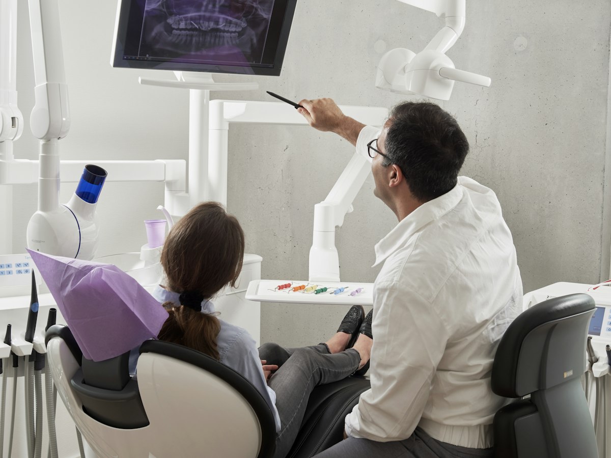 Dentist reviewing a 3D intraoral scan with a patient
